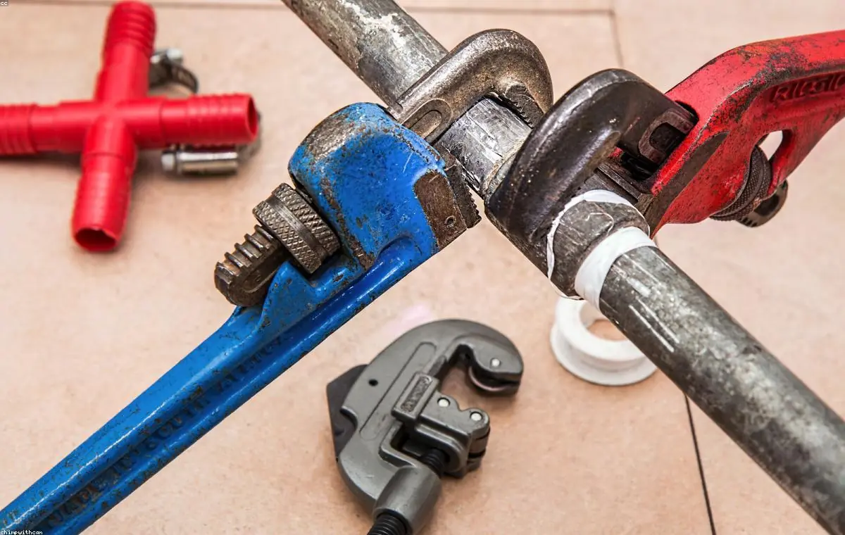 Licensed plumber repairing a pipe in a Torrance home